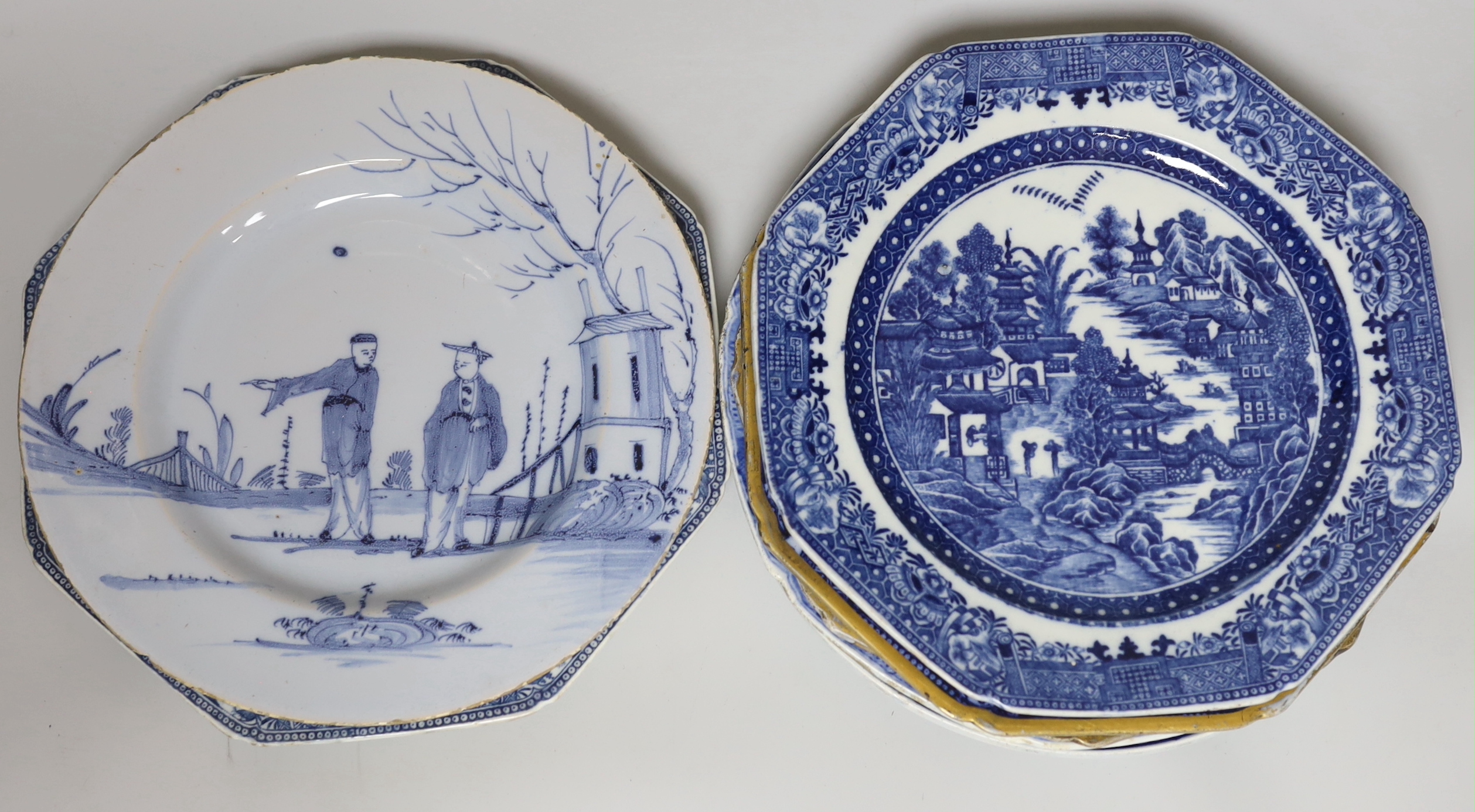A collection of pearlware blue and white plates and two tea canisters, c.1790-1810, A Worcester Hollow Rock pattern saucer and an English delftware plate painted with Chinese figures, 23cm diameter